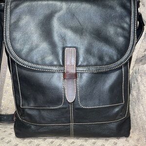 The territory ahead, black with brown leather trim, laptop bag